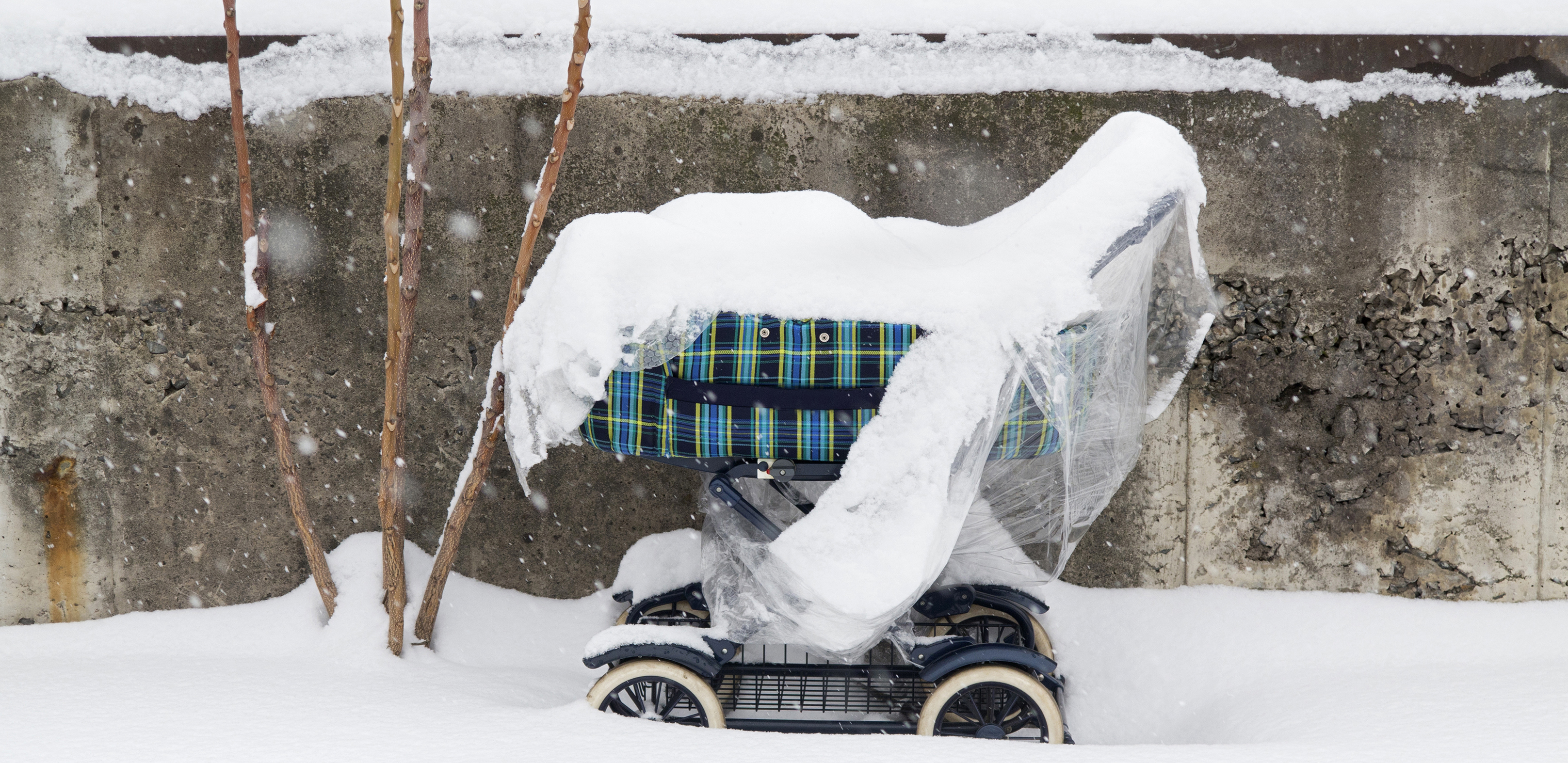 Weatherproof Baby - imafe of the snowy baby carriage